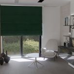 Elegant Roman blind in stylish bottle green velvet