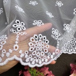 Subtle curtain with white embroidered floral pattern 