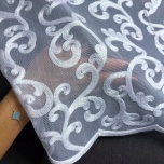 Stylish curtain with patterned white embroidery on bottom 