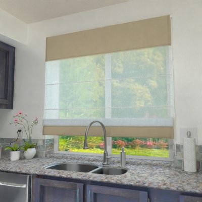 A voile roman blind, dual fabric, sewn to size. Curtain fabric inside, upper and lower segments in light caramel.