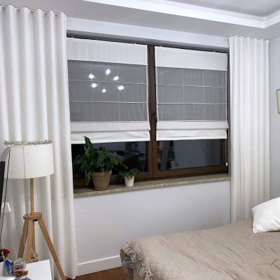 Voile roman blind, dual fabric. Upper and lower segments in white