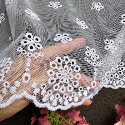 Subtle curtain with white embroidered floral pattern 