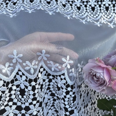 Stylish elegant curtain with white guipure ornamental pattern